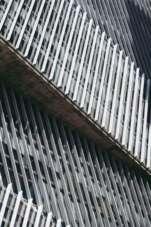 a building made out of wood slats and metal screens