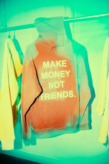 the neon colors of a shirt that says make money not friends