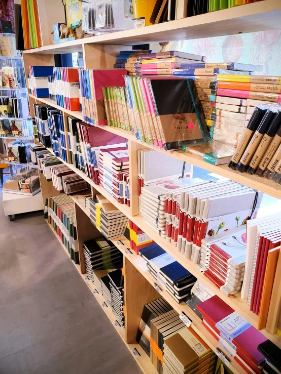 this is a shelf with various folders and books