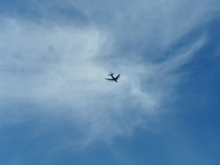 a very large airplane flying through the sky