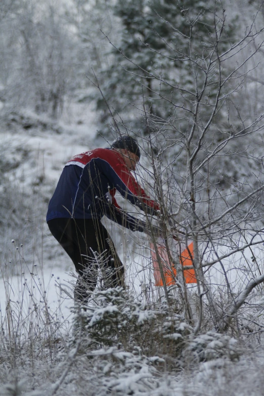 a man is working in a field covered with snow