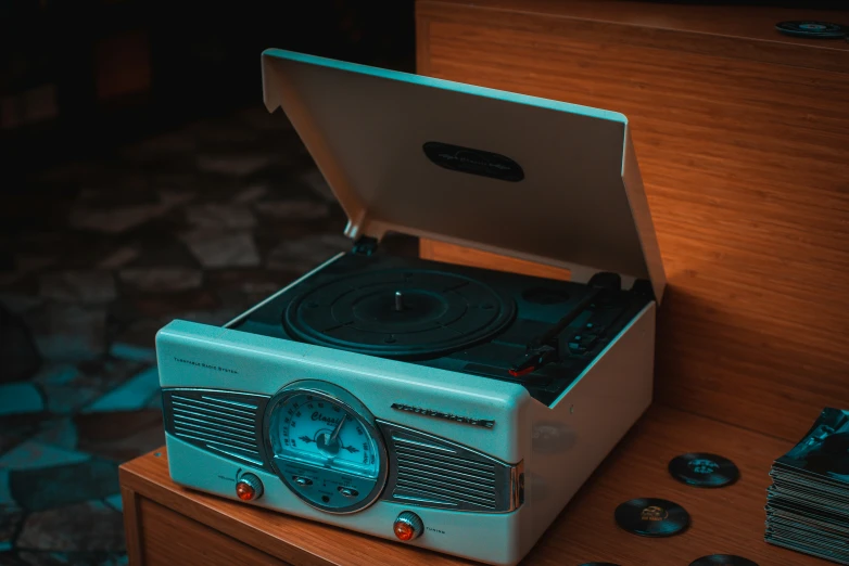 a small stereo system sitting on top of a wooden table