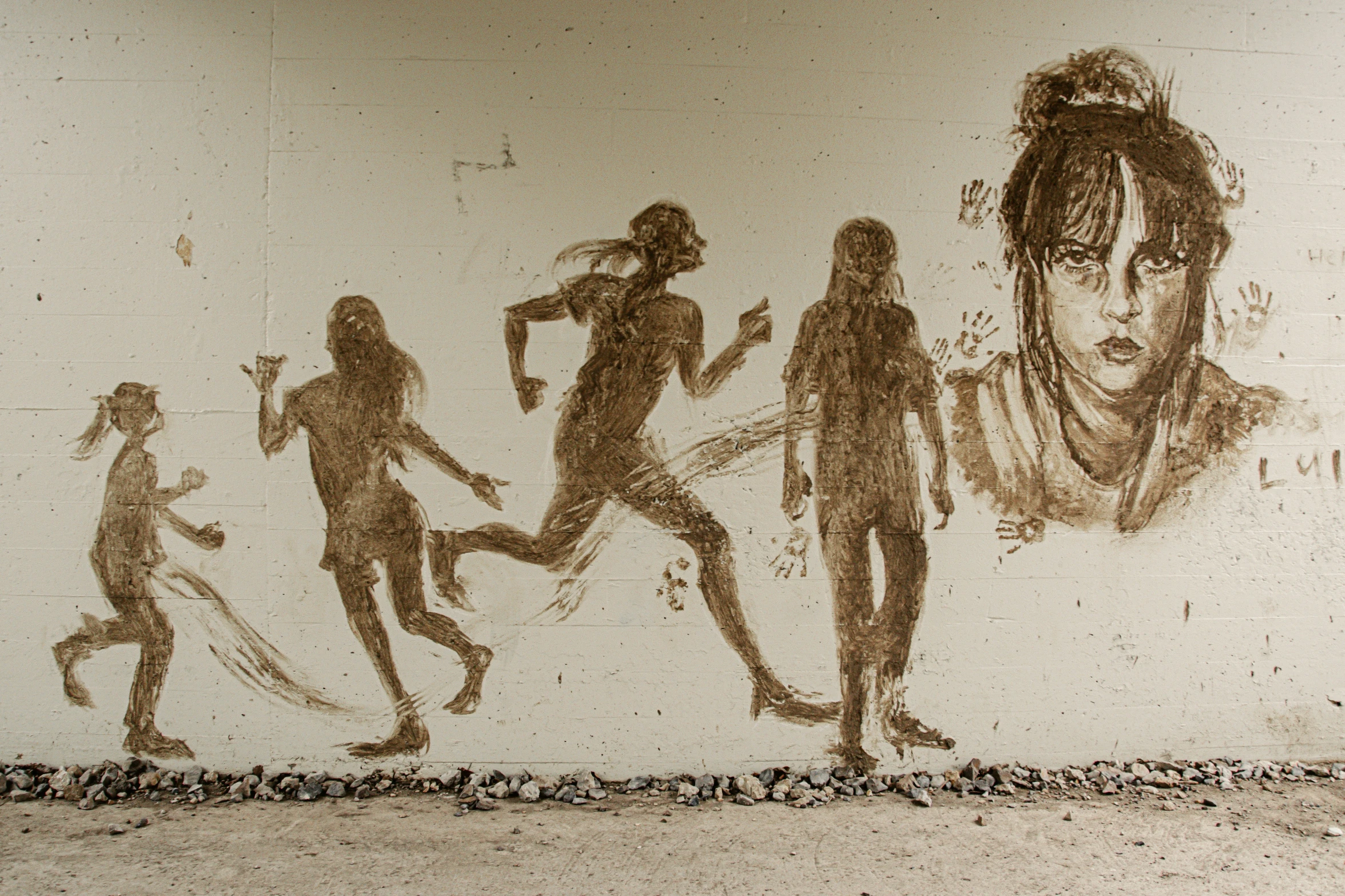 a street wall with multiple hand drawn images of people walking and being watched