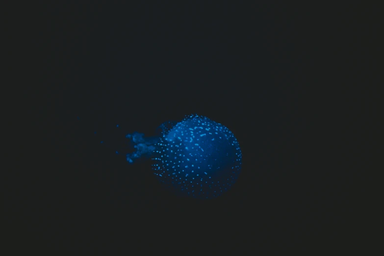 a blue object that is very blurry and shining blue