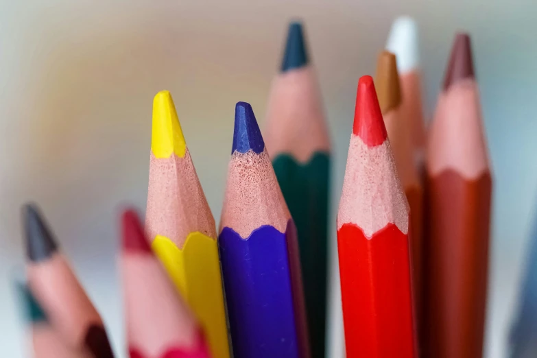 close up s of colorful pencils sitting in a row