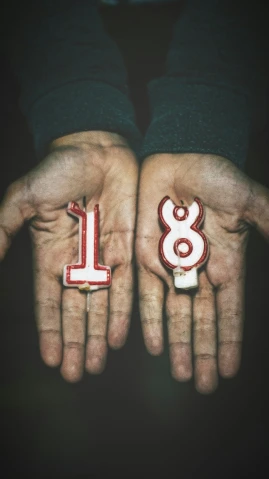 two people wearing hands made to look like numbers