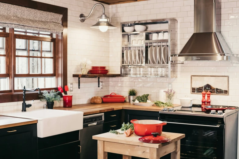 kitchen with an old fashioned stove and some red dishes