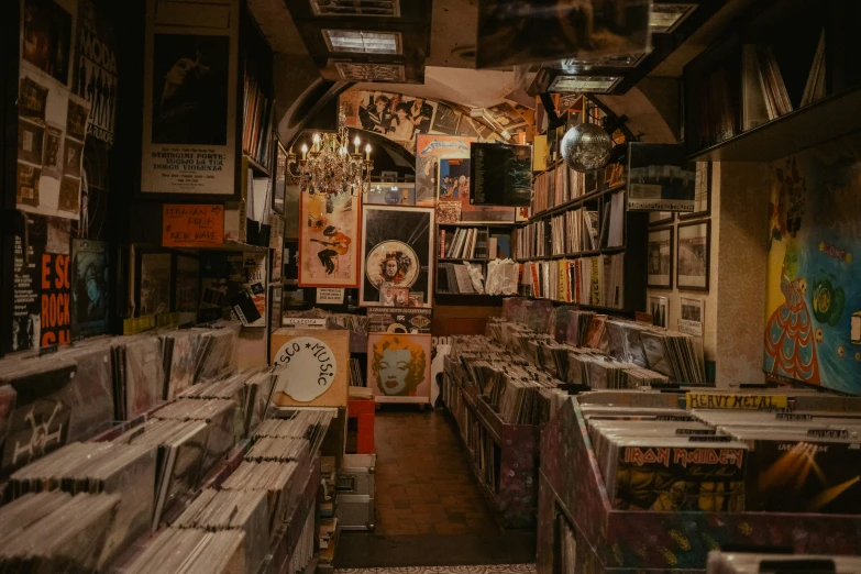 a room with some records on the wall and a bunch of cds in it