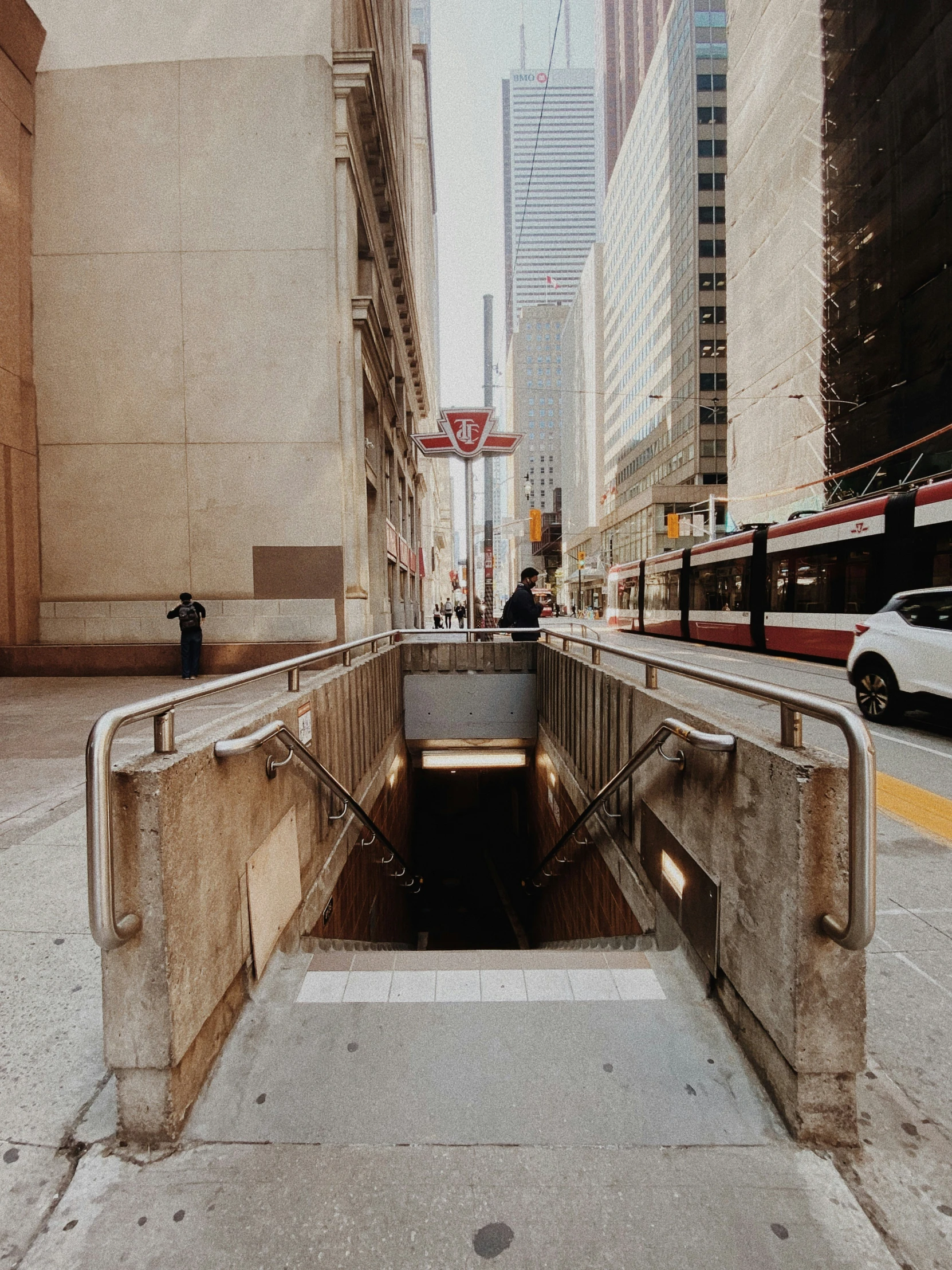 someone looking into an underground tunnel in a city