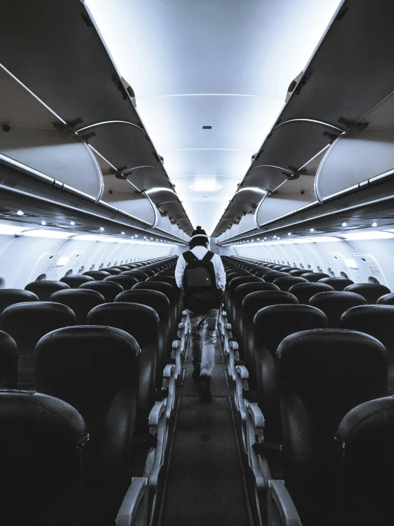 the inside of an airplane with empty seats