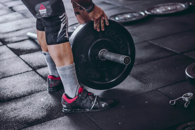 a person who is holding a gym disc