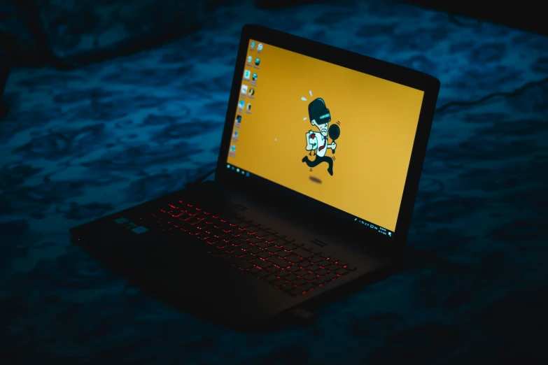 an open laptop computer sitting on top of a table