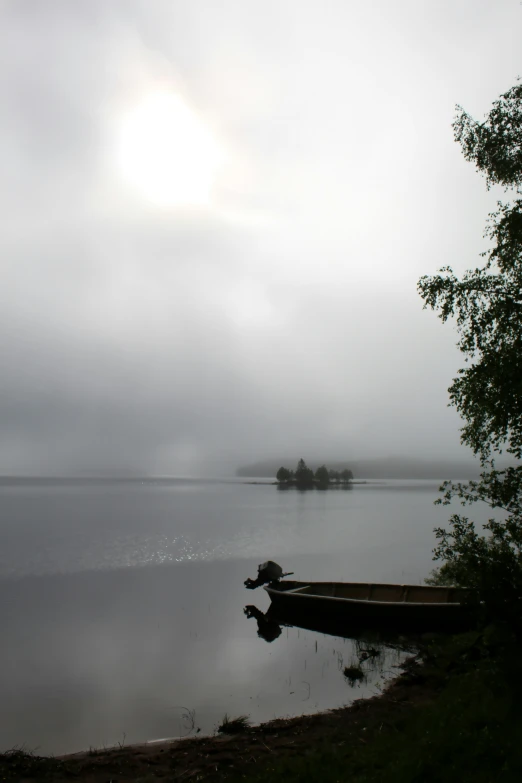 there is a boat at the dock on a river