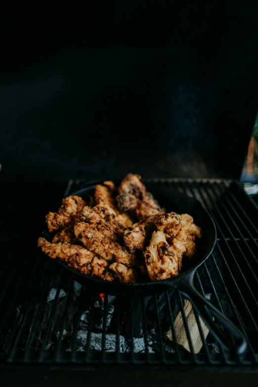 fried foods being cooked on an outdoor grill