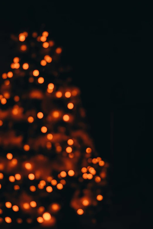 a christmas tree with many small white lights
