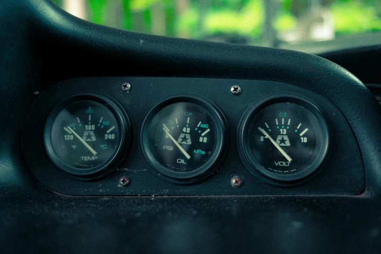 the gauges of a vehicle are showing in all three different displays