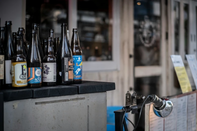 the table is covered with bottles of beer