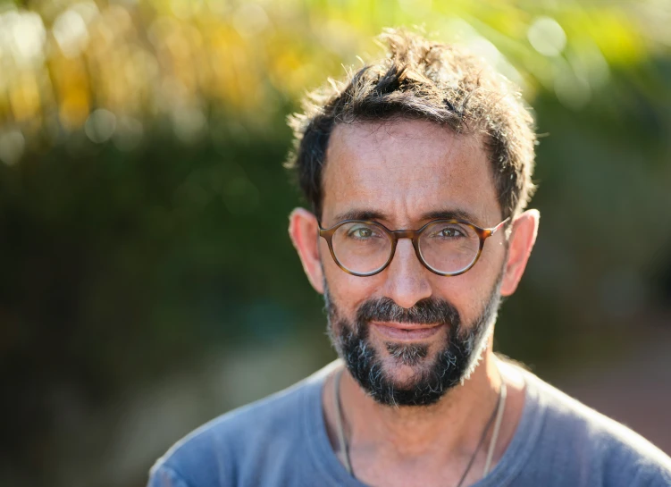 an image of a man with glasses and a beard