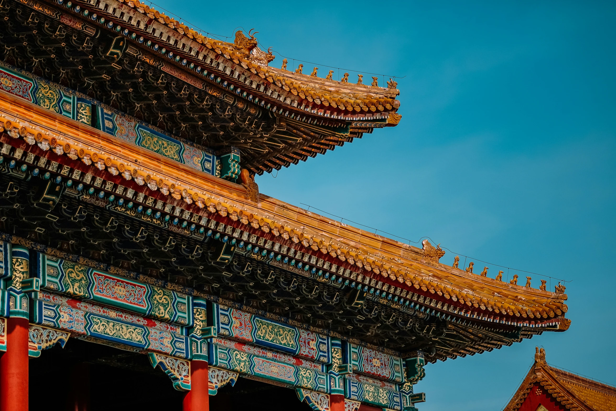 the roof is covered with many tiles and intricate designs