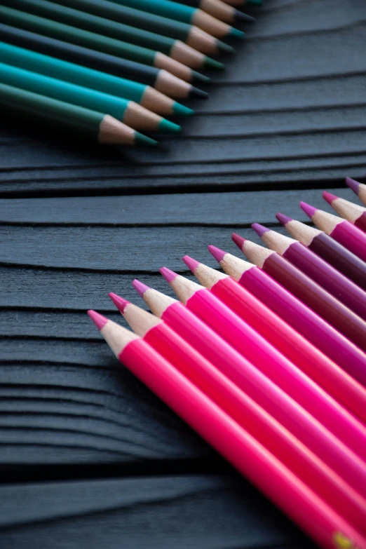 colorful pencils lined up in rows next to each other