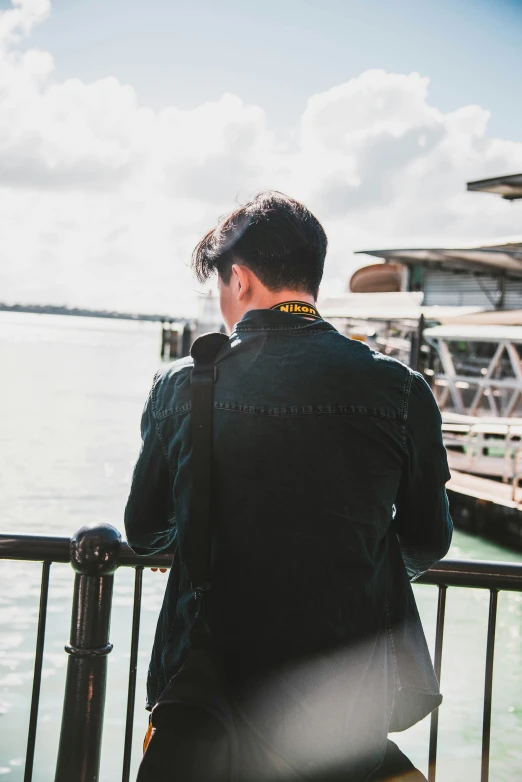 a man is watching out to sea from a balcony