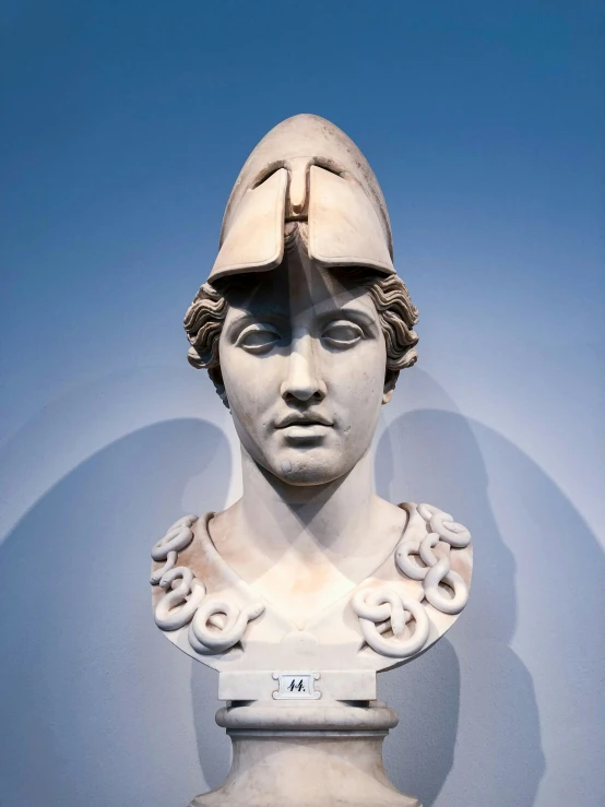 a statue of the head and shoulders of a man in a helmet