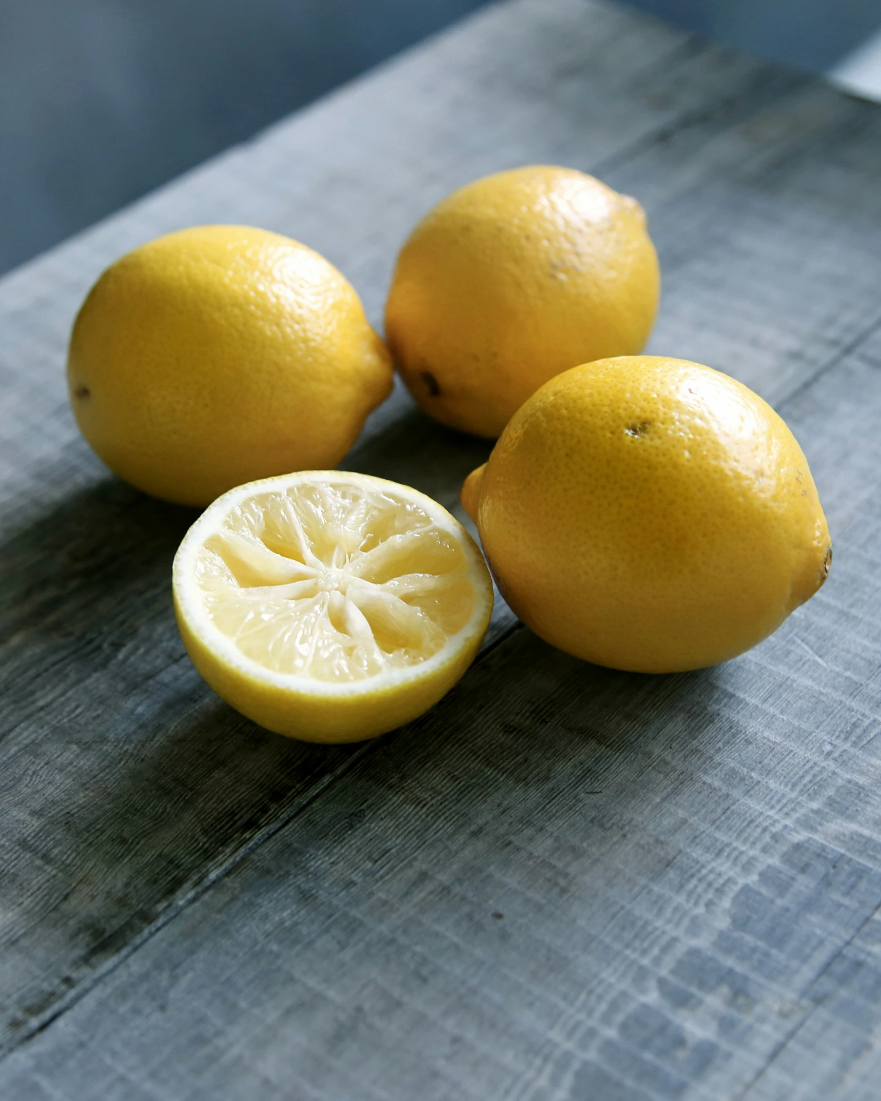 some lemons are laying on top of the table