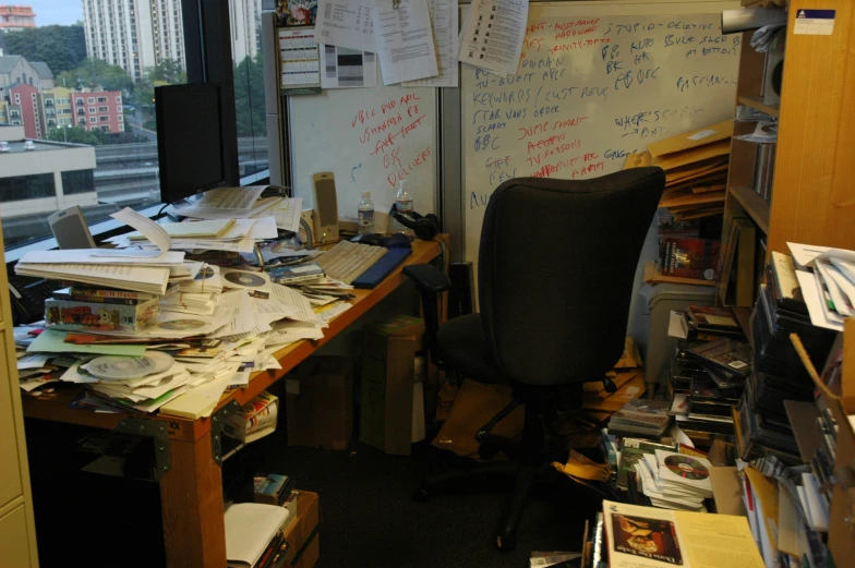 an office is cluttered with papers and files