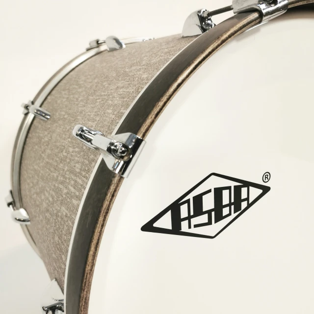 a white and silver snimbo drum case with black logos