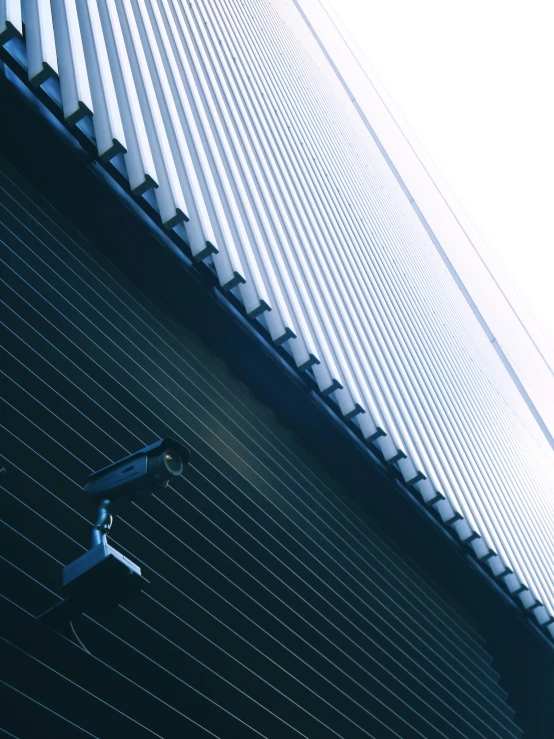 a security camera outside of a building in an open space