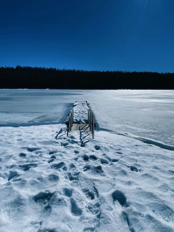 a walkway is seen walking across snow