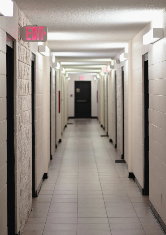 a line of toilets with pink letters next to them