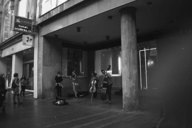 a group of people are gathered outside a building