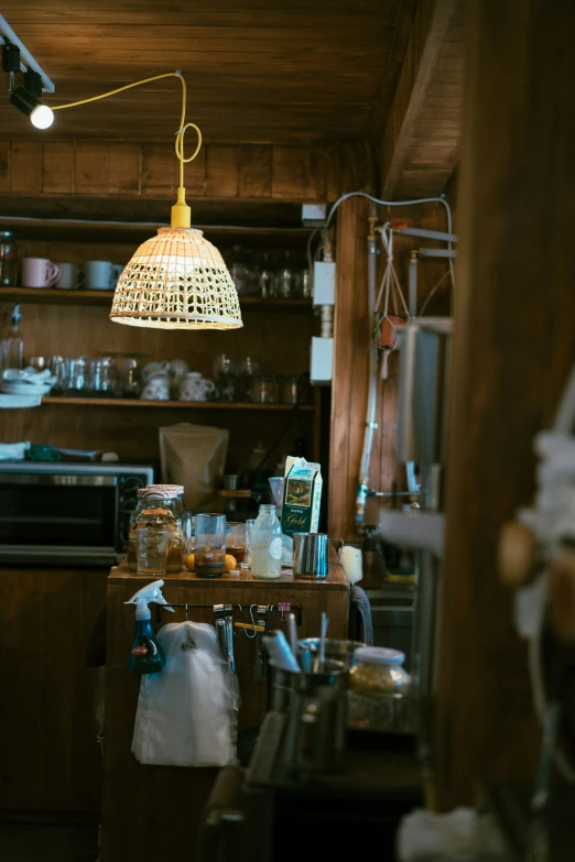 a room with a lamp, a sink and a counter