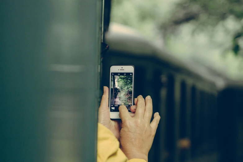 a person taking a po on a cellphone