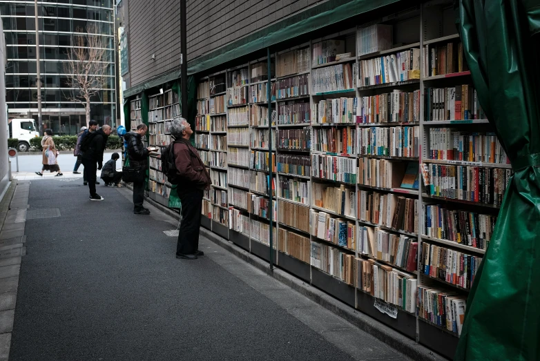 a bunch of books that are sitting on the wall