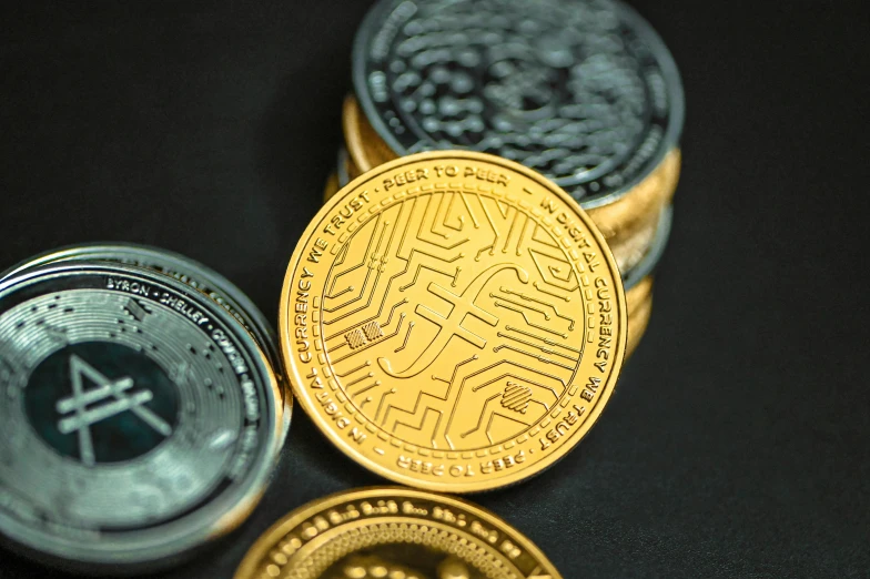 a gold coin with the letters and symbols on it