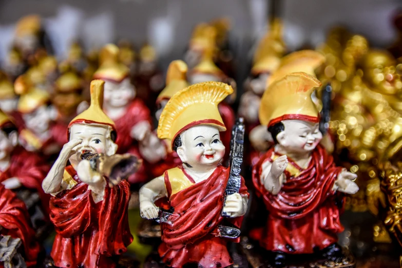 the figurines of oriental chinese merchants are red