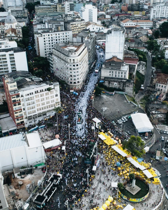 an aerial view of a city with many pedestrians