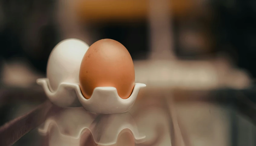 an egg in a ed egg holder on a table