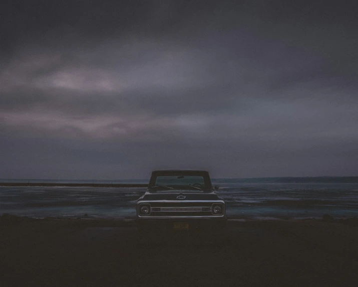 a car sitting on the beach during the day