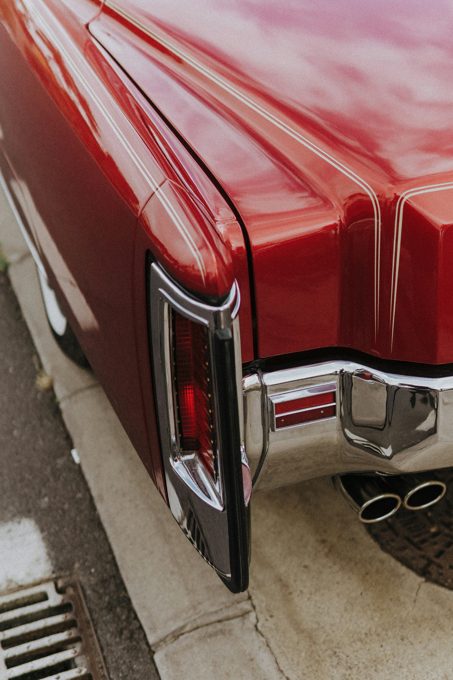 close up s of the rear end of an old red car