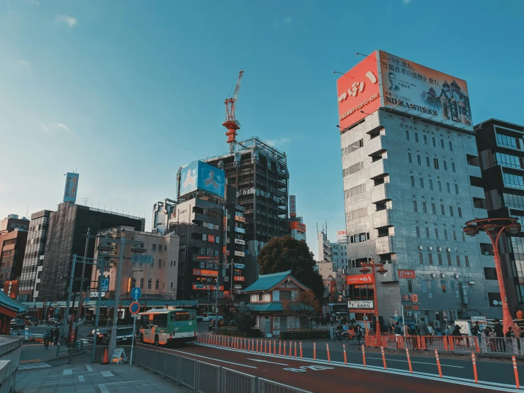 a city street filled with tall buildings next to traffic