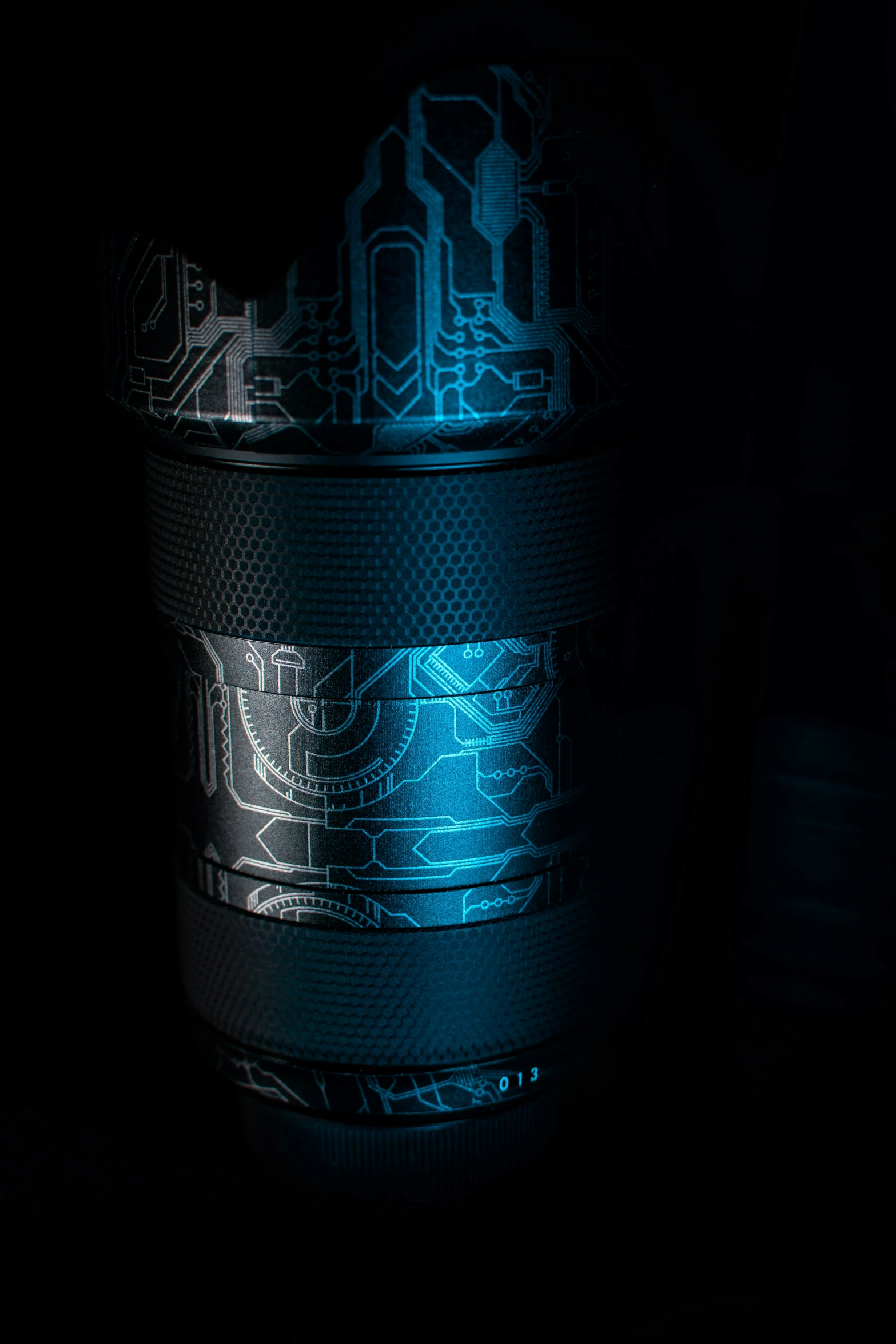 a tin with a dark background of blue and black