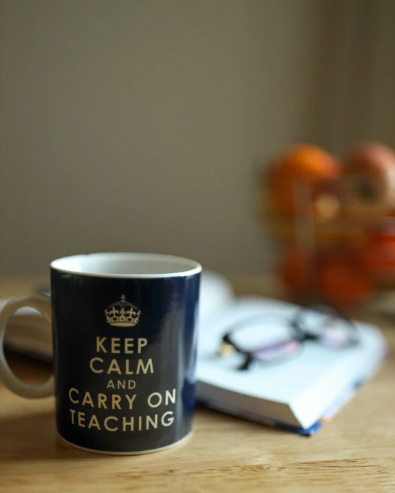 a coffee cup sitting on a wooden table