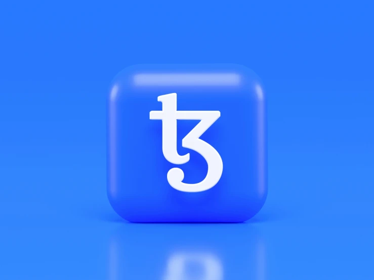 a on with the letter t3 sitting in front of a blue background