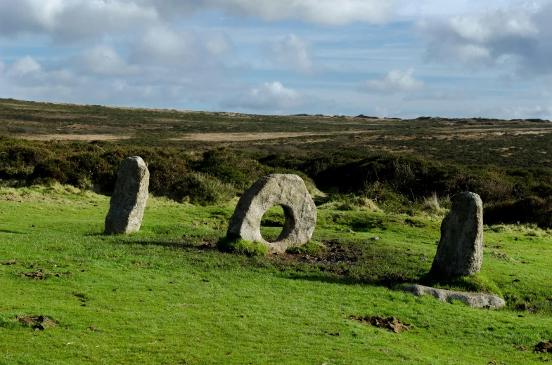 an ancient cemetery stands in a lush green field