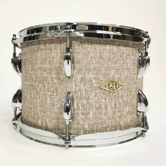 a silver frame is around a brown drum