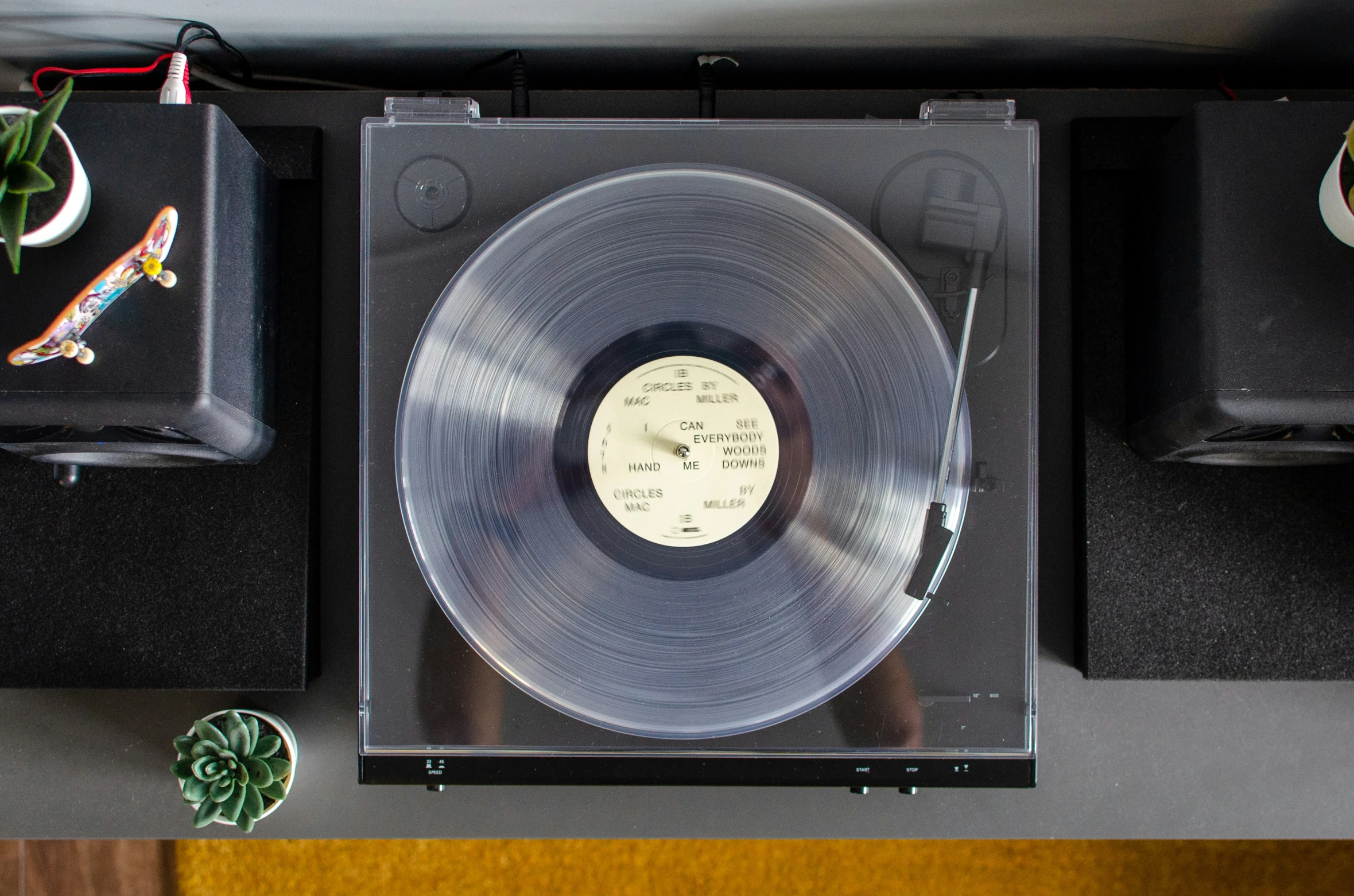 the vinyl is on the table near other musical instruments