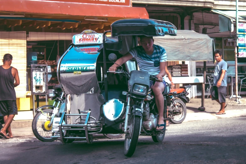 a motorcyclist with a person riding on the back